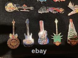 HUGE Hard Rock Cafe Beatles Anthology Springsteen 70+ pin lot withcollectors bag